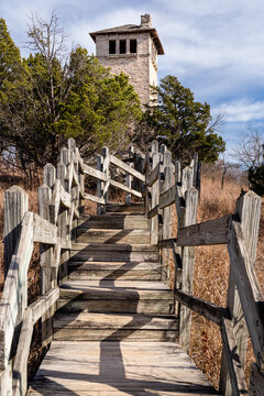 Wooden stairs lead to the base of the abandoned water tower at Ha Ha Tonka State Park, Missouri
