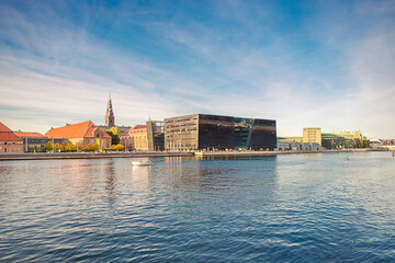 The Black Diamond building of One of the largest library in the world - national Royal Library of the University of Copenhagen near water canal. Copenhagen, Denmark - obrazy, fototapety, plakaty
