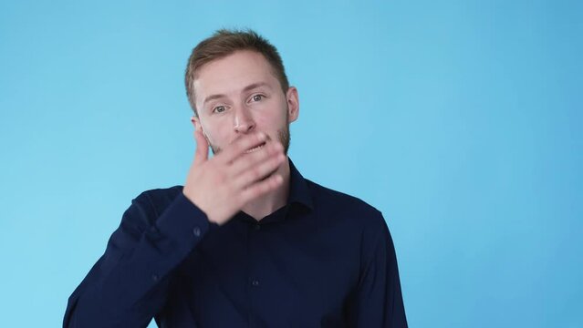 Different expression. Mood change. Comedy drama. Boomerang motion. Man switches happy sad facial emotions with hand hidden face isolated on blue background GIF loop animation.