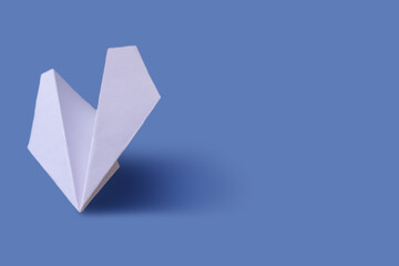 Paper airplane on a tone-harmonious background, toned