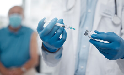 The first batch of vaccinations is being rolled out. Cropped shot of an unrecognizable male doctor...