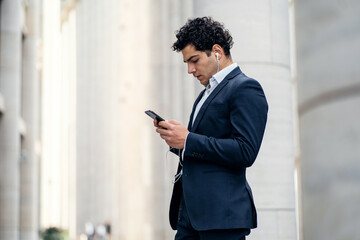 The manager uses the phone a business man in a formal suit goes to work in the office