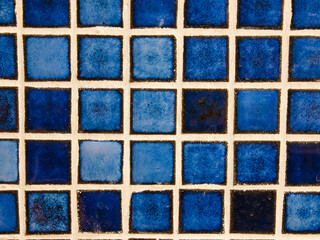 blue square tiles. Wall in a bathroom. Abstract background