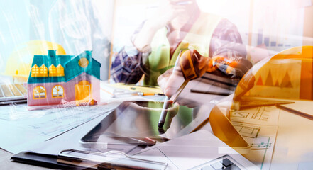 engineer people meeting working and pointing at a drawings in office for discussing. Engineering tools and construction concept.