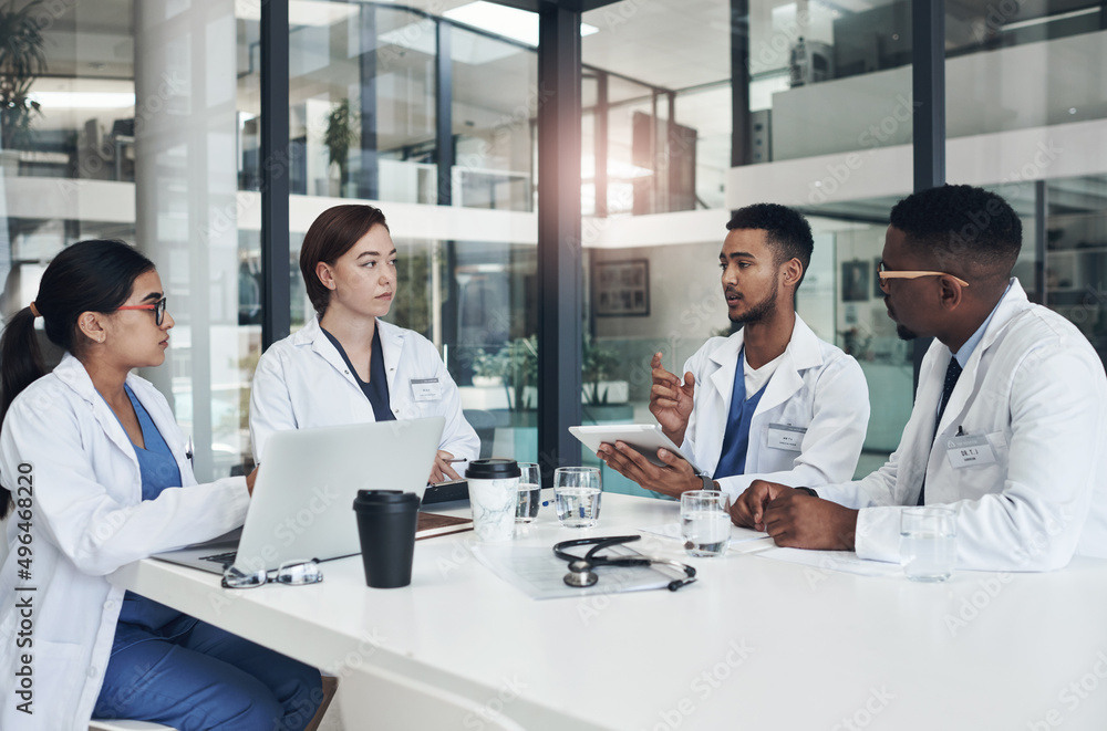 Poster we need to go over what happened. shot of a group of doctors having a meeting together.