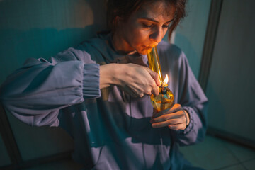 Woman using bong smoking pot
