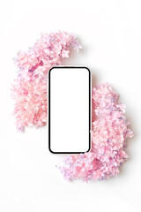 Smartphone mockup with pink flowers. Device screen mock up on stylish background for presentation or appl design