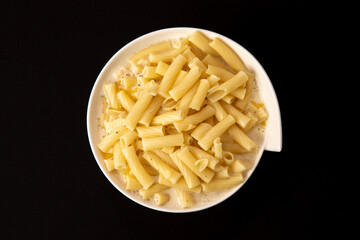 Top View if a Portion of Macaroni and Cheese in a white bowl