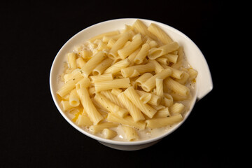 Top View if a Portion of Macaroni and Cheese in a white bowl
