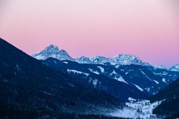 Sunrise over snow capped mountain peaks of Karawanks in Carinthia, Austria. Julian Alps. Scenic...