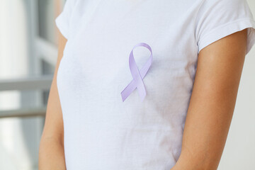 Woman with blue ribbon, prostate cancer awareness
