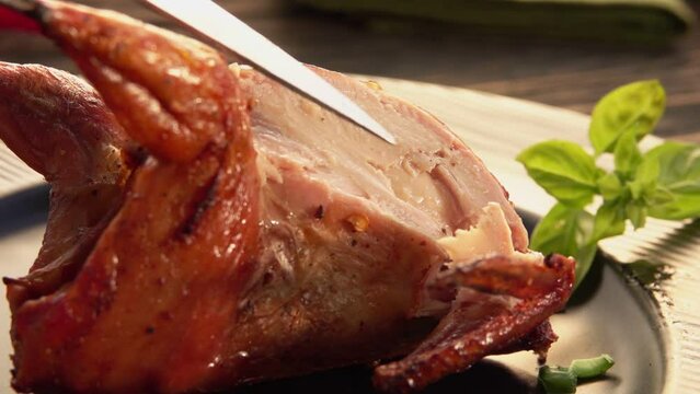 Close-up view of a fork taking away a piece of mouth-watering fried quail