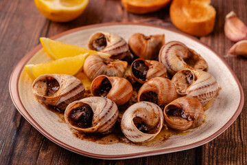 snails with butter on a plate