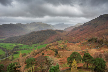 Fototapeta premium Stunning colorful Autumn landscape image of view from Castle Crag towards High Stile and Glaramara in Lake District