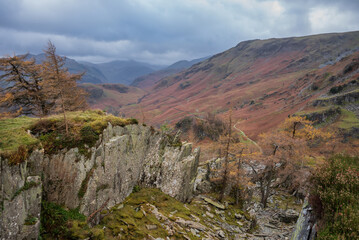 Fototapeta na wymiar Stunning colorful Autumn landscape image of view from Castle Crag towards High Stile and Glaramara in Lake District
