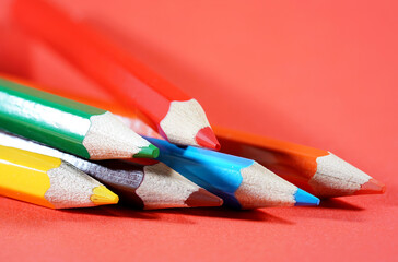 pencils on red background