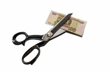 hand with scissors cutting Russian ruble