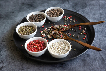 Different types of peppers on different surfaces.