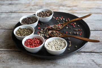 Different types of peppers on different surfaces.