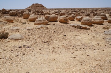 Unreally spherical rocks concretions in Nahal Keidar reserve, South Israel, sunset time, twilight