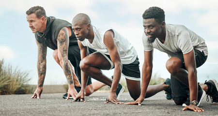 Your only competition is against who you were yesterday. Shot of a group of men getting ready to start a race.