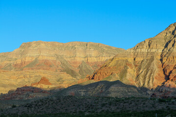 Fototapeta na wymiar sunny dry mountains shadows mountain foreground desert arid range landscape