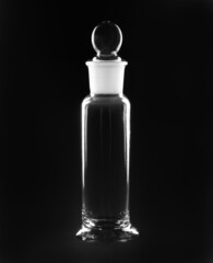 medical laboratory flask with cap on black background