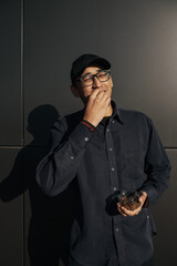 happy african american man holding metal scoop with raisins