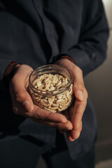 Different types of nuts, nut of peanuts in hands.