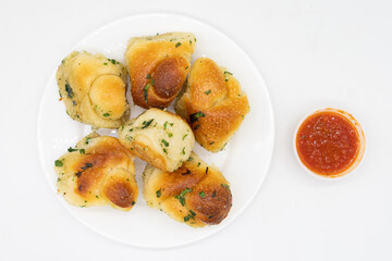 Garlic Knots and a Cup of Marinara Sauce