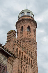 Fototapeta na wymiar brick tower in neomudejar style in the mansion of Laredo in Alcalá de Henares. Spain