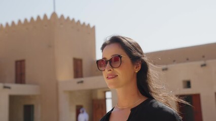 woman tourist visiting the ancient fortress of Al Zubarah at Qatar landmark
