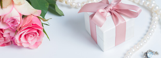 Box with pink ribbon