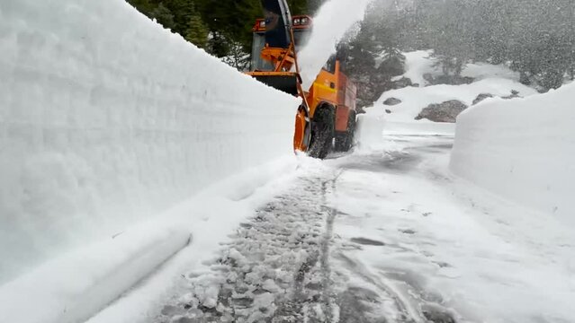 operation of the snowblower to open the road for service