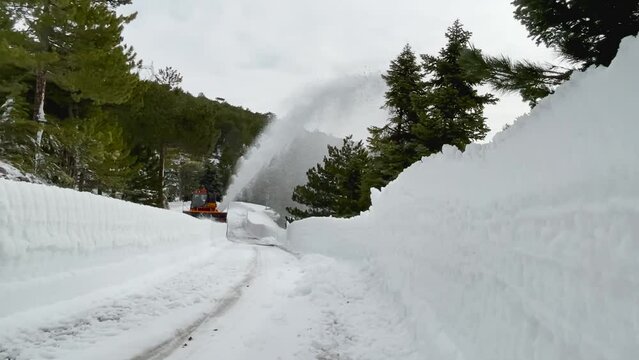 operation of the snowblower to open the road for service
