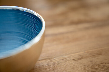 Blue silver italian glass bowl close up on wood