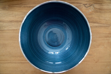 Blue silver italian glass bowl close up on wood