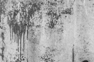 Black painted concrete surface old stained paint wall grey texture spilled gray cement streaks background