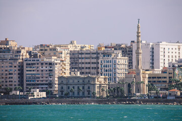 Fototapeta na wymiar Panoramic View to the City of Alexandria with Citadel, Mediterranean Sea Embankment, Road, Streets and Local Buildings, Egypt 