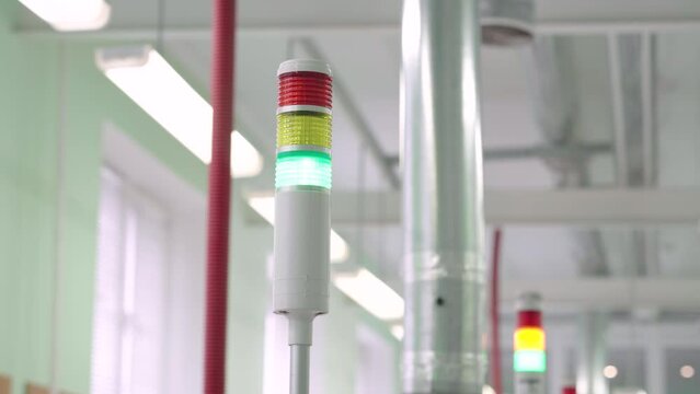 Traffic light on the factory. Turning on the green light on the production line. . High quality 4k footage