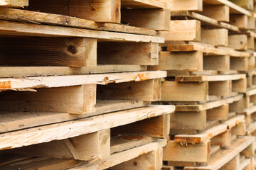 Stack of wooden pallets used for transporting heavy goods