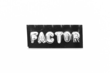 Black color banner that have embossed letter with word factor on white paper background