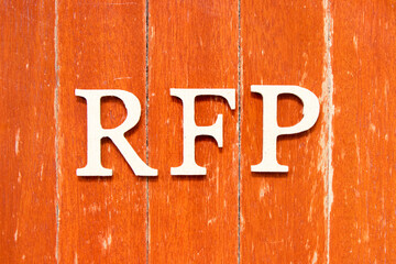 Alphabet letter in word  RFP (Abbreviation of request for proposal) on old red color wood plate background
