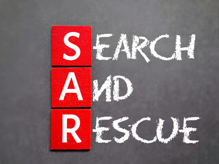 Search and rescue text background. SAR as its abbreviation. Stock photo. 