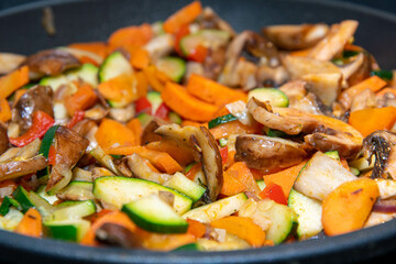 Vegetable pan with fresh mushrooms and vegetables