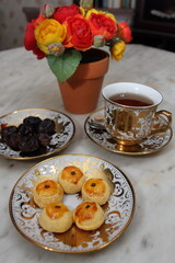 Some Nastar cookies, sweet dates, and a cup of hot tea for Ramadan break fasting.