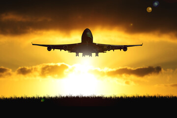 Fototapeta na wymiar Silhouette of a passenger plane taking off from the airport
