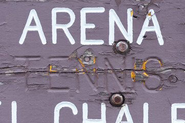 old recreation complex sign: arena, tennis (painted out) and ?