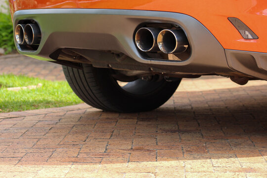 Large exhaust pipes on the back of a high performance vehicle