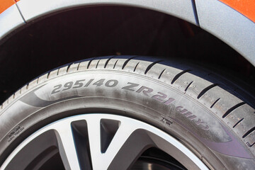 Close up of a tire sized 295/40 ZR21